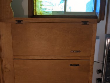 refinished kitchen cabinet upper above washing machine